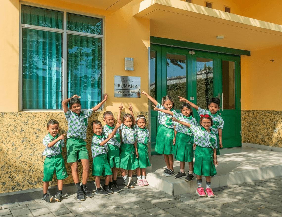 Children in green uniforms